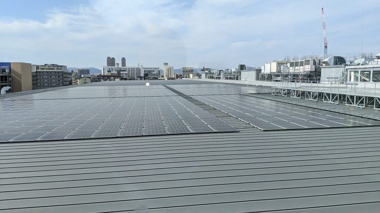 Photograph of a large solar park in a desert region generating renewable energy.