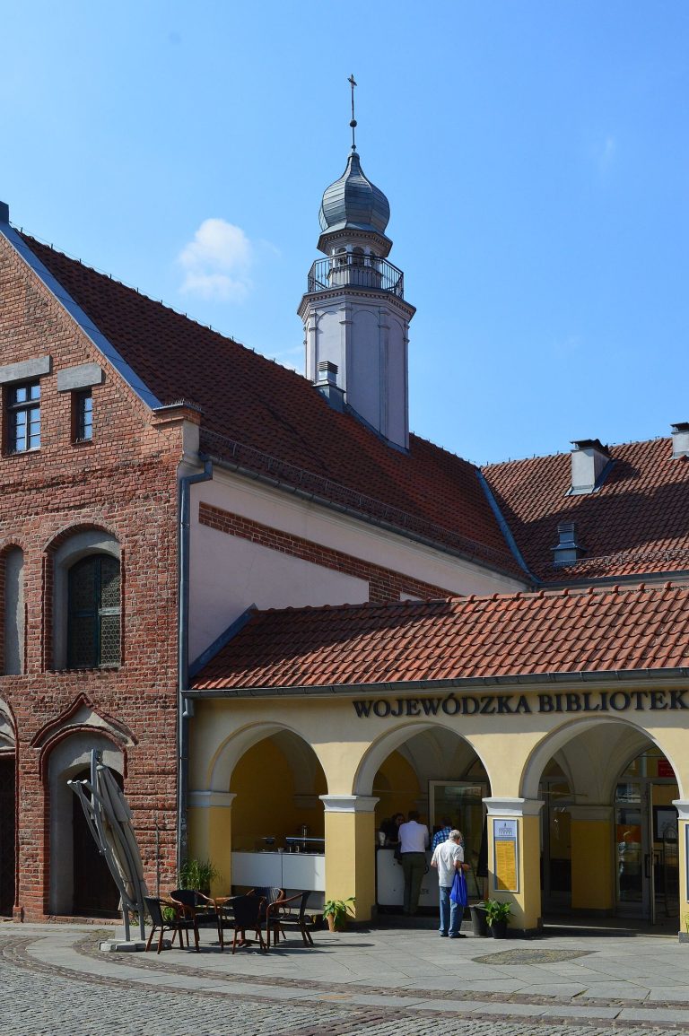 Heritage Cities Test Visitor Caps to Protect Daily Life A historic old town street