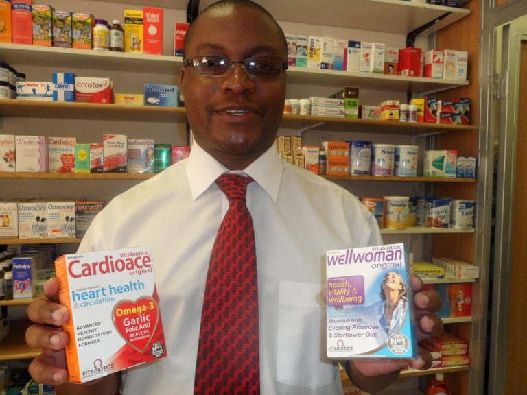 Pharmacy Vaccination Clinics Widen Seasonal Access A pharmacist in a pharmacy